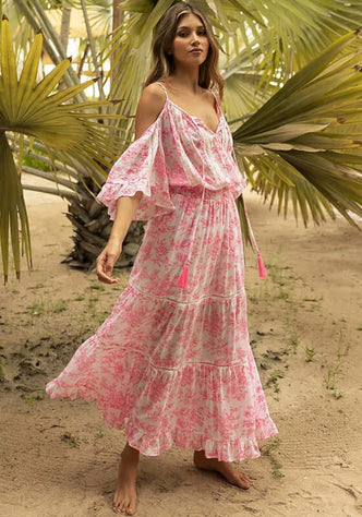 Karena Dress Pink by Miss June, featuring a floral off-the-shoulder kaftan dress on model against tropical backdrop.