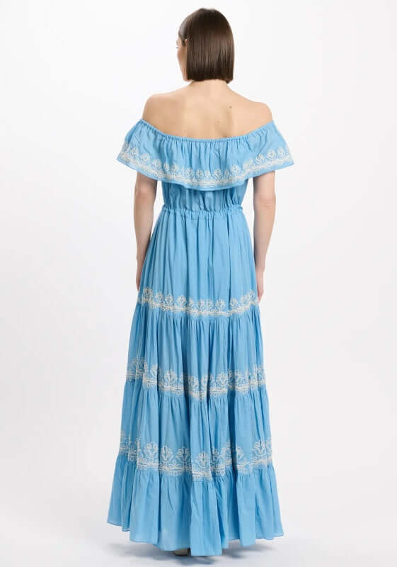 Malone Dress Blue by Miss June, showcasing the back view with tiered skirt and white embroidery details.