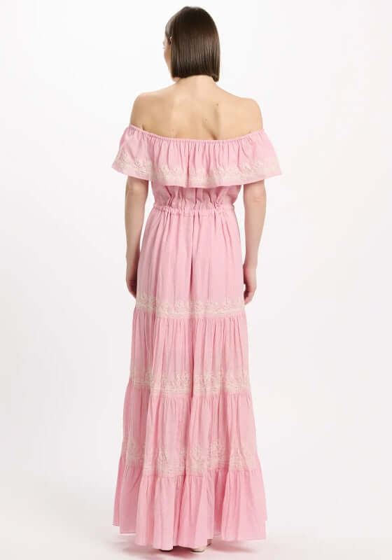Malone Dress Pink by Miss June, showcasing the elegant off-shoulder back and tiered silhouette with white embroidery.