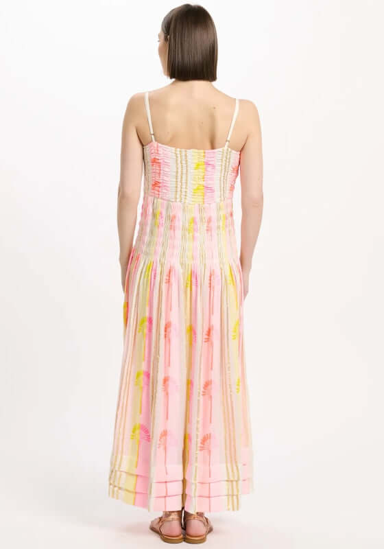 Perla Beach Dress by Miss June, showcasing the back view with smocked bust and tiered ruffled skirt in neon colors.