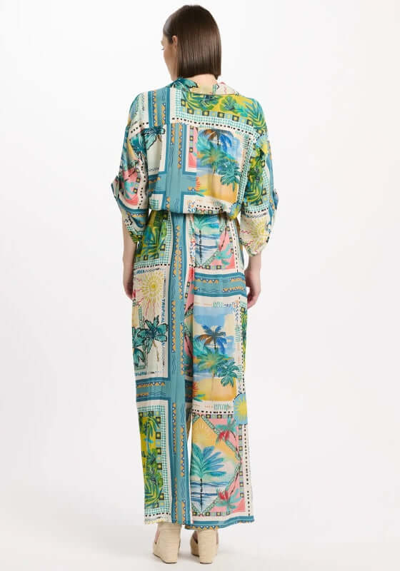 Swan Jumpsuit by Miss June, featuring a colorful floral design and relaxed shirt-style silhouette from the back.