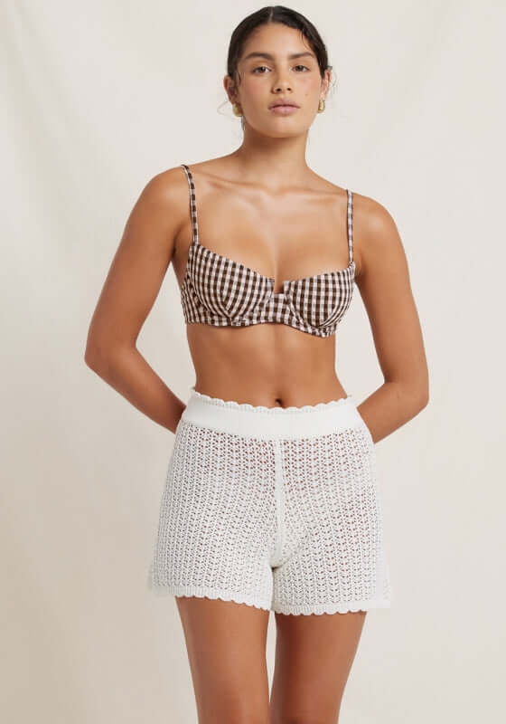 Pointelle Shorts Seashell by Peony, featuring a stylish model in soft, breathable summer shorts with an elegant perforated pattern.