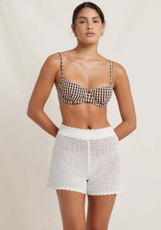 Pointelle Shorts Seashell by Peony, featuring a stylish model in soft, breathable summer shorts with an elegant perforated pattern.