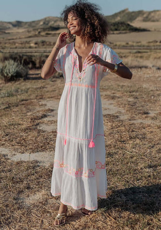 Holbox Long Dress Natural by Piti Cuiti, a flowing beach dress with hand-embroidered details and vibrant tassels.