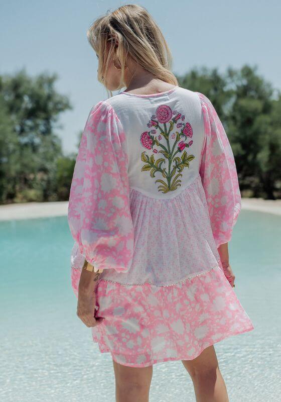 Amber Short Dress White Pink by Piti Cuiti featuring balloon sleeves and floral embroidery, perfect for the beach.