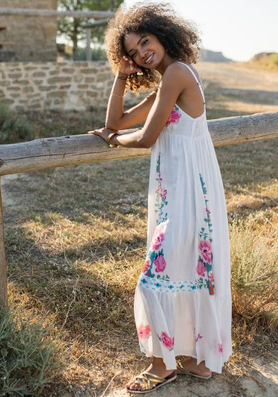 Bonaire Dress White Pink by Piti Cuiti, featuring a V-neckline and floral pattern, perfect for beach days and casual wear.