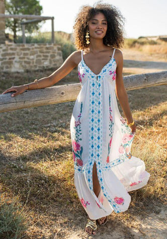 Bonaire Dress White Pink by Piti Cuiti, strappy maxi dress with floral print and a flowing silhouette, perfect for beach days.