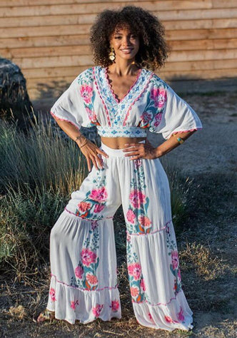 Bonaire Beach Trousers White Pink by Piti Cuiti, featuring hand-painted floral details and a relaxed fit, perfect for beach style.
