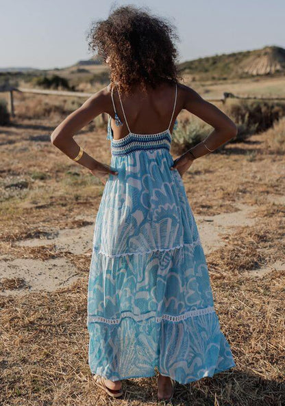 Shell Long Dress Blue by Piti Cuiti, featuring a delicate crochet top and flowing tiered skirt in shades of blue.