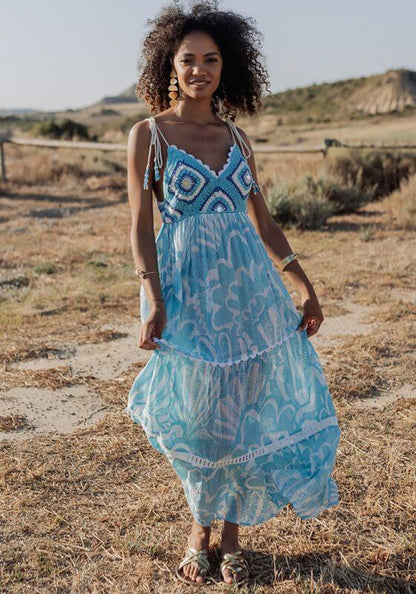 Shell Long Dress Blue by Piti Cuiti, featuring a crochet top and flowing tiered skirt in stunning blue and white hues.