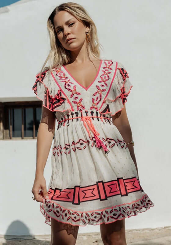 Sidi Kaouki Short Dress by Piti Cuiti featuring vibrant neon pink embroidery and tassel drawstring waist.