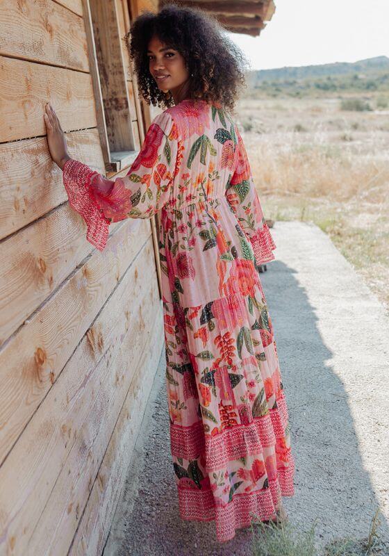 St Barths Beach Dress Orange by Piti Cuiti, vibrant floral dress with peplum sleeves and tropical patterns.