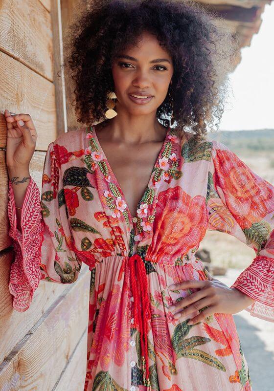 St Barths Beach Dress Orange by Piti Cuiti, vibrant dress with orange flowers and green leaves, showcasing tropical style.