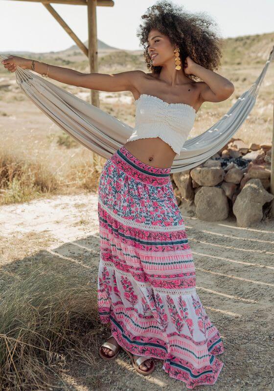 Zanzibar Long Skirt Pink Indigo by Piti Cuiti worn by a model in a natural setting, showcasing vibrant patterns and relaxed silhouette.