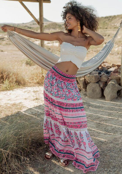 Zanzibar Long Skirt Pink Indigo by Piti Cuiti worn by a model in a natural setting, showcasing vibrant patterns and relaxed silhouette.