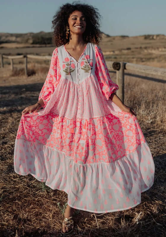 Ambar Long Beach Dress Orange Neon by Piti Cuiti, vibrant tiered maxi dress with balloon sleeves in neon colors.