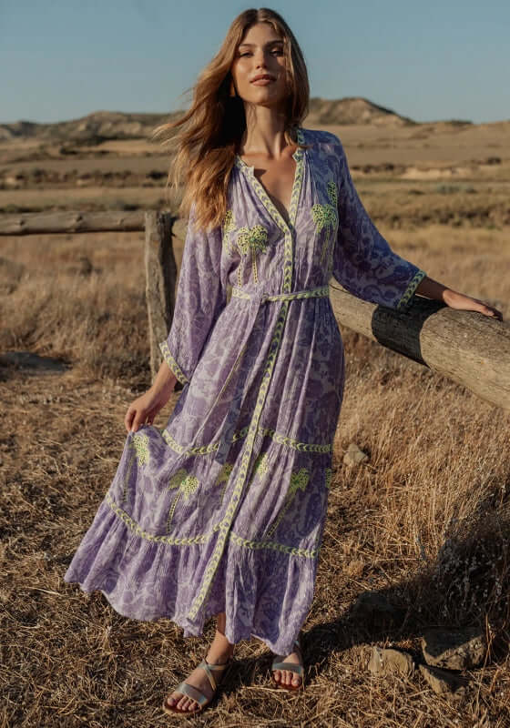 Sahara Purple Long Dress by Piti Cuiti, featuring a V neckline, balloon sleeves, and tiered skirt, perfect for casual occasions.