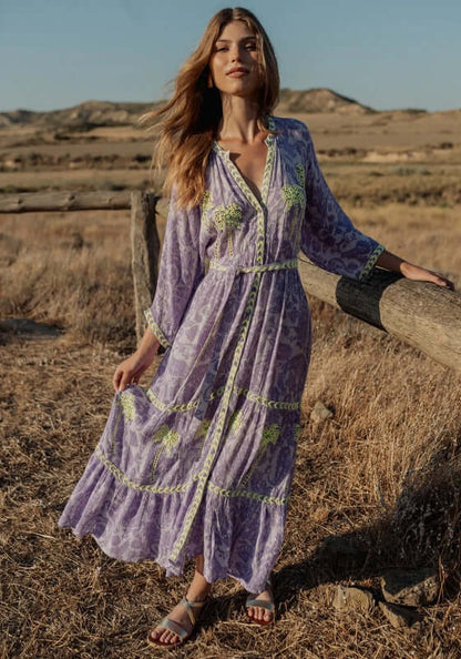 Sahara Purple Long Dress by Piti Cuiti, featuring a V neckline, balloon sleeves, and tiered skirt, perfect for casual occasions.