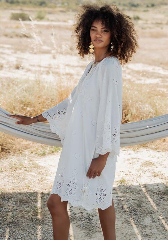 Santorini Dress White by Piti Cuiti, a breezy white dress with flare sleeves and cutout details, perfect for summer.