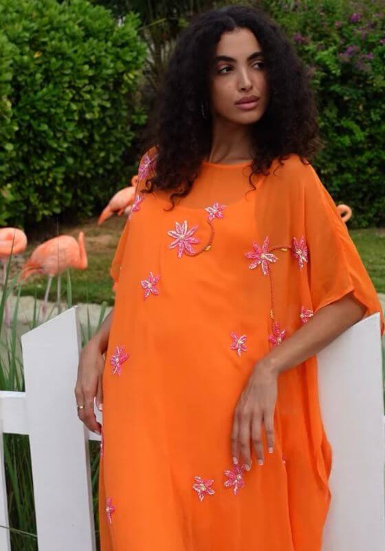 Cordelia Beaded Kaftan Orange by Pitusa, featuring delicate beadwork and a flowing silhouette in vibrant orange.