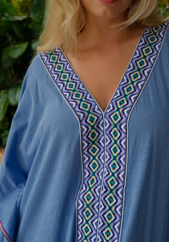 Monochromatic Thobe Periwinkle by Pitusa, featuring deep V-neckline and intricate Inca trim detail.