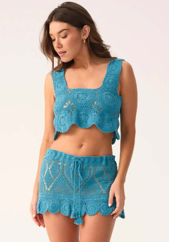 Saltwater Aria Top by PQ Swim, showcasing a blue crochet design for a relaxed bohemian beach vibe.