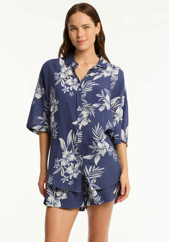 Aloha Beach Shirt French Navy by Sea Level, featuring floral print, button details, and short sleeves on a model.