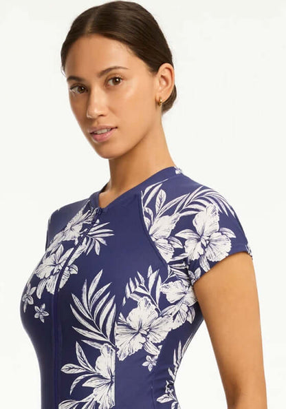 Aloha Short Sleeved Zip Front Swimsuit by Sea Level, featuring a floral design and short sleeves for summer style.