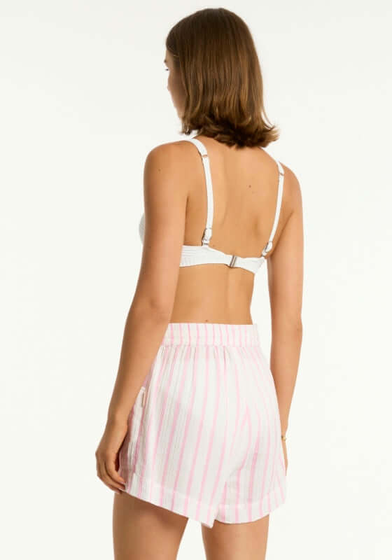 Amalfi Beach Shorts Pink by Sea Level showcasing loose fit design and pink striped pattern from the back view.