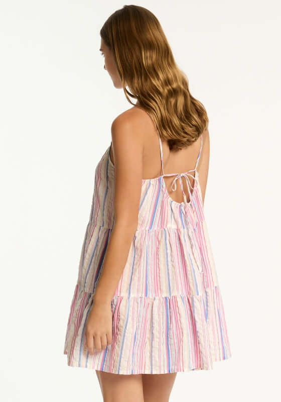 Boho Stripe Beach Dress Blue by Sea Level, featuring a tie-back detail and playful stripes for a breezy summer look.