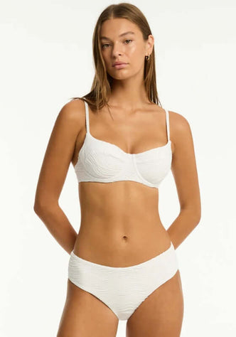 De Soleil Balconette Bikini White by Sea Level displayed on a model, showcasing its eco-friendly fabric and elegant design.