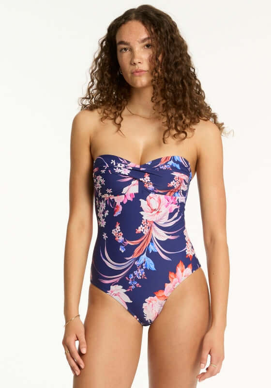 Indochine Twist Bandeau Swimsuit French Navy by Sea Level features a floral design, flattering twist-front bandeau style.