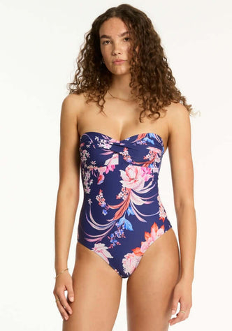 Indochine Twist Bandeau Swimsuit French Navy by Sea Level features a floral design, flattering twist-front bandeau style.