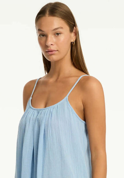 Sunset Short Sundress Cornflower Blue by Sea Level, model wearing a lightweight cornflower blue sundress with spaghetti straps.