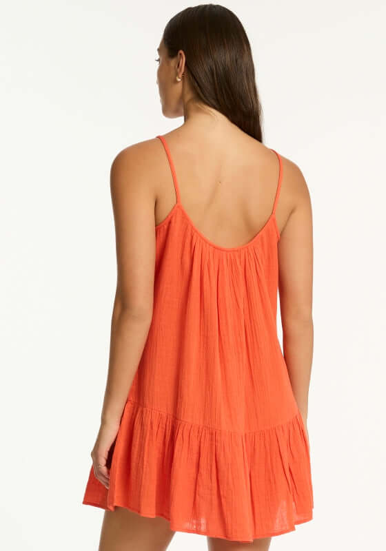 Sunset Short Beach Dress Flame by Sea Level, showcasing the back view of a red flame dress with a tiered design.