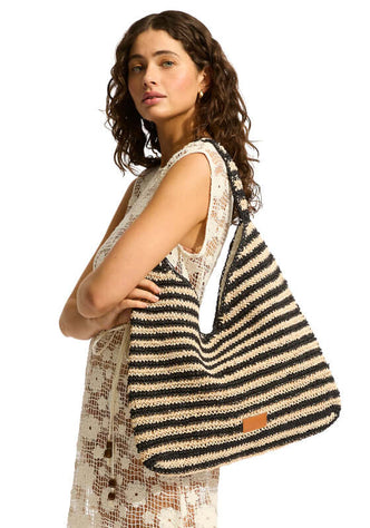 Raffia Stripe Tote by Seafolly, showcasing a stylish beach bag with a striped design and magnetic closure.