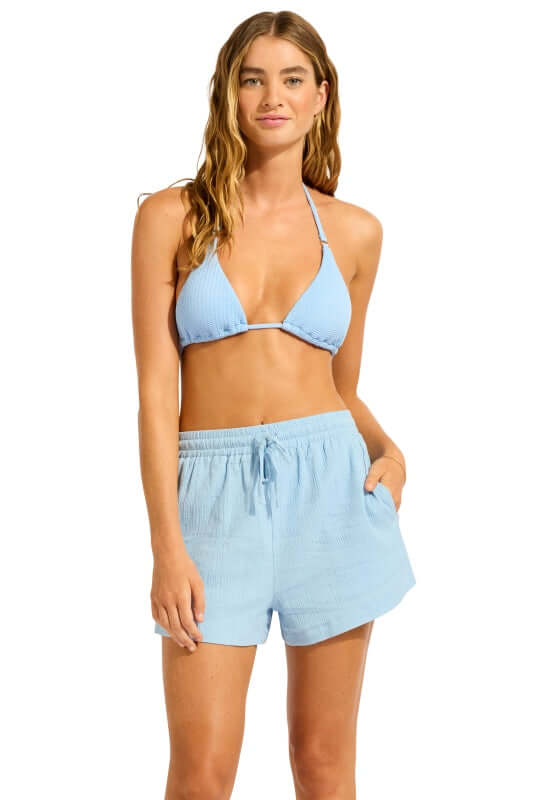 Crinkle Short Cornflower Blue by Seafolly model wearing soft cotton beach shorts with drawstring waist and side pockets.
