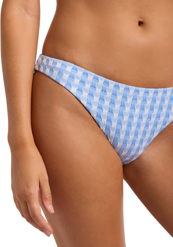 Bella Hipster Bikini Bottom Cornflower by Seafolly, showcasing a stylish blue checkered design on a model.