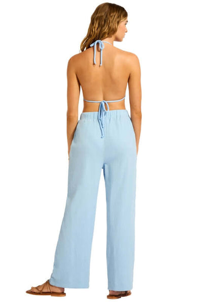 Crinkle Beach Trousers Cornflower Blue by Seafolly, featuring a model wearing soft crinkle cotton trousers with drawstring waist.