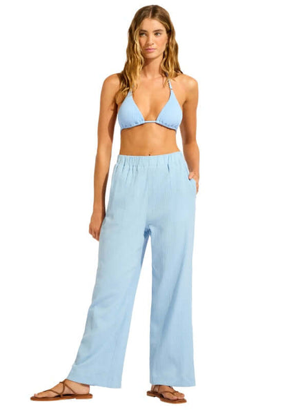 Crinkle Beach Trousers Cornflower Blue by Seafolly, model wearing soft, crinkle cotton trousers with drawstring waist and side pockets.