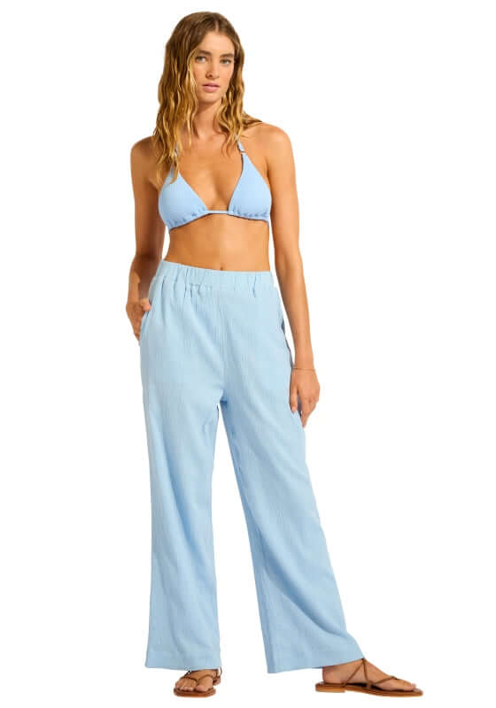 Crinkle Beach Trousers Cornflower Blue by Seafolly, model wearing soft crinkle cotton trousers at the beach.
