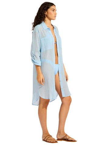 Crinkle Twill Beach Shirt Cornflower Blue by Seafolly model wearing a lightweight beach shirt over swimwear with relaxed fit.