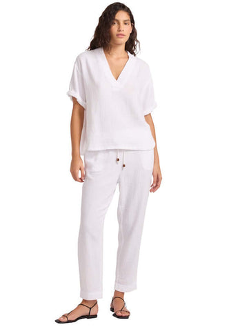Double Gauze Tapered Beach Trouser by Seafolly, model wearing white beach trousers and matching top.