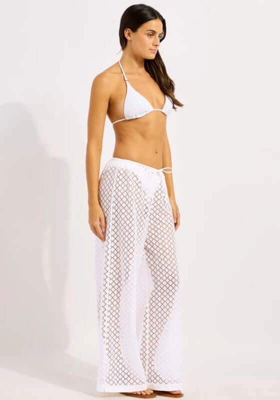 Drawstring Lace Beach Trousers White by Seafolly, model showcasing lightweight lace trousers over bikini.