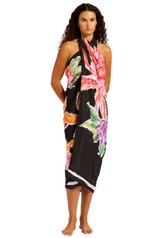 Black House of Flowers Sarong by Seafolly, showcasing vibrant floral print on a black background.