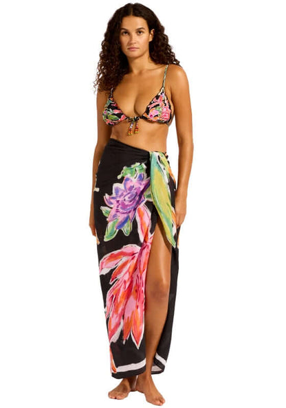 Black House of Flowers Sarong by Seafolly worn by model, showcasing vibrant floral prints on a black background.