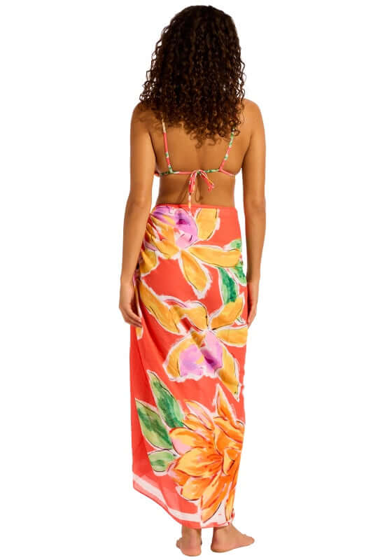 Melon House of Flowers Sarong by Seafolly, showcasing a vibrant floral print on a red background.