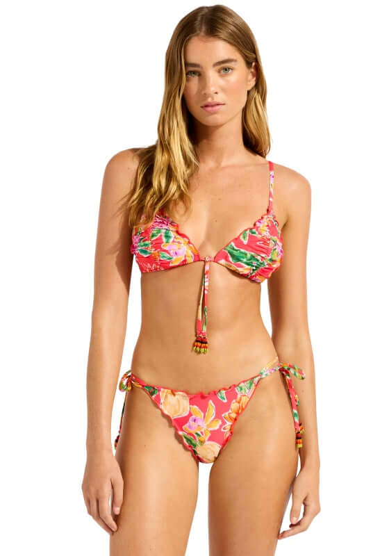 Melon House of Flowers Triangle Bikini Top by Seafolly, featuring a vibrant floral pattern on a model.
