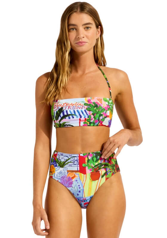 La Boca Bandeau Bikini by Seafolly model wearing a colorful bandeau bikini with high-rise bottoms.