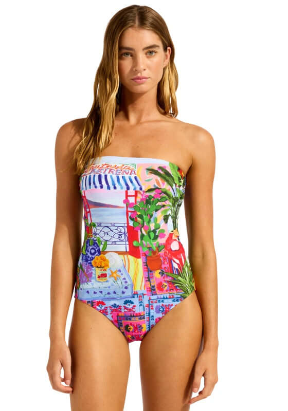 La Boca Bandeau Swimsuit by Seafolly model wearing vibrant bandeau swimsuit with colorful print, perfect for beach days.